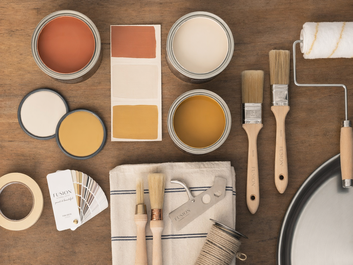 Premium paint cans in multiple colours with brushes and palette — quality materials used by Raddysolution